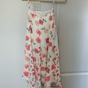 White dress with lace detailing and flowers